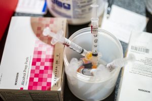 vaccine syringes in cup